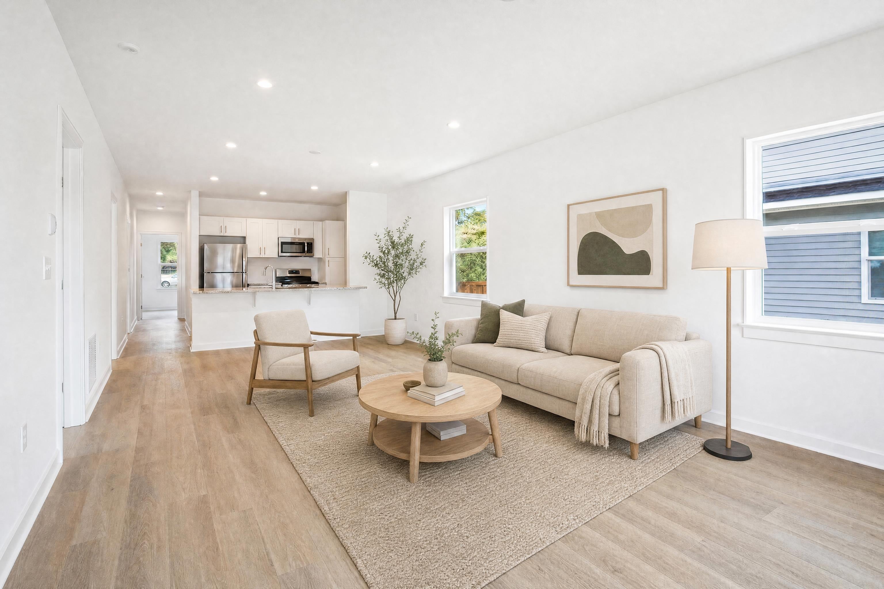 Living room in a small new-construction home, virtually staged in a Scandinavian style