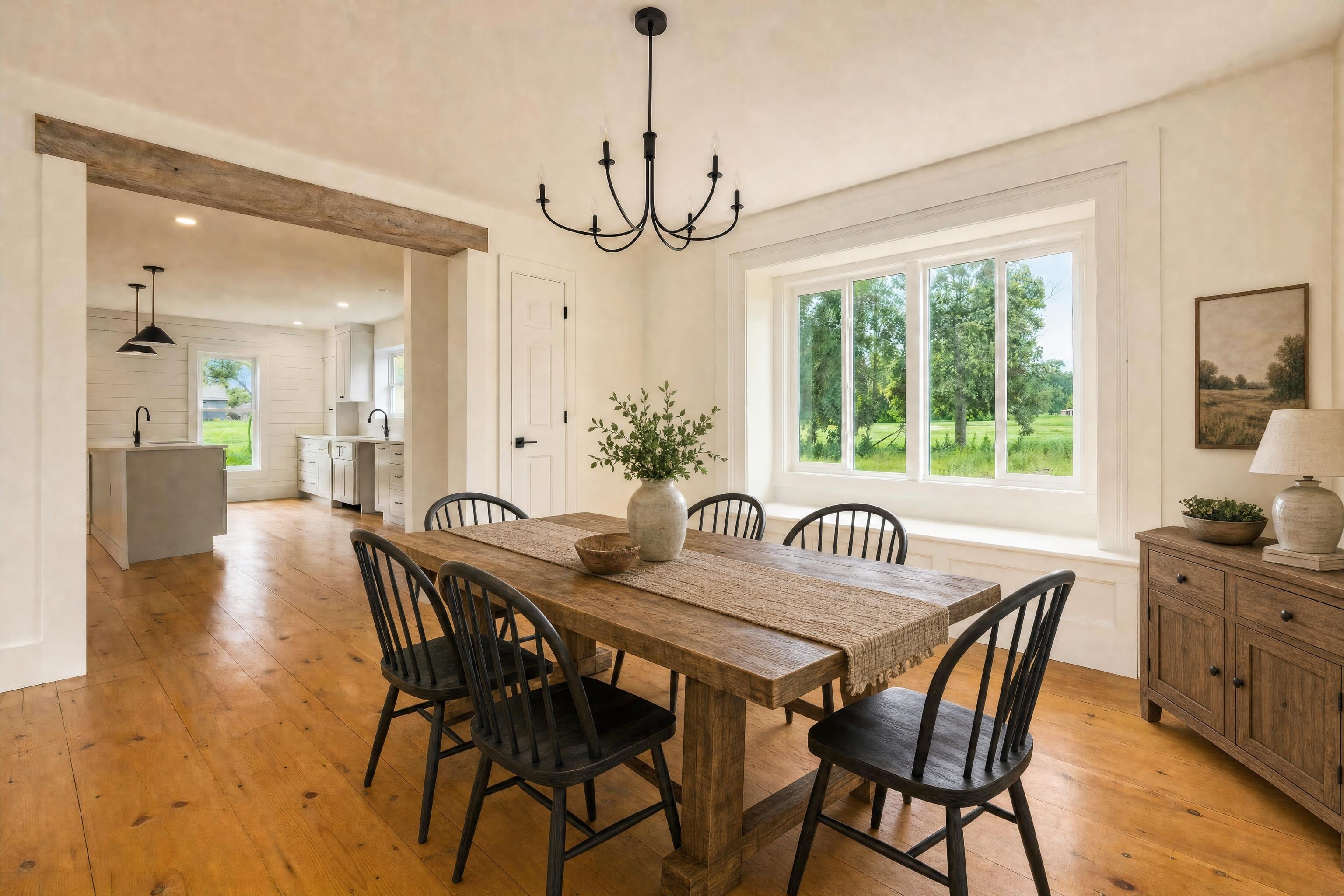 Eat-in kitchen dining area in a renovated farmhouse, virtually staged in a farmhouse style